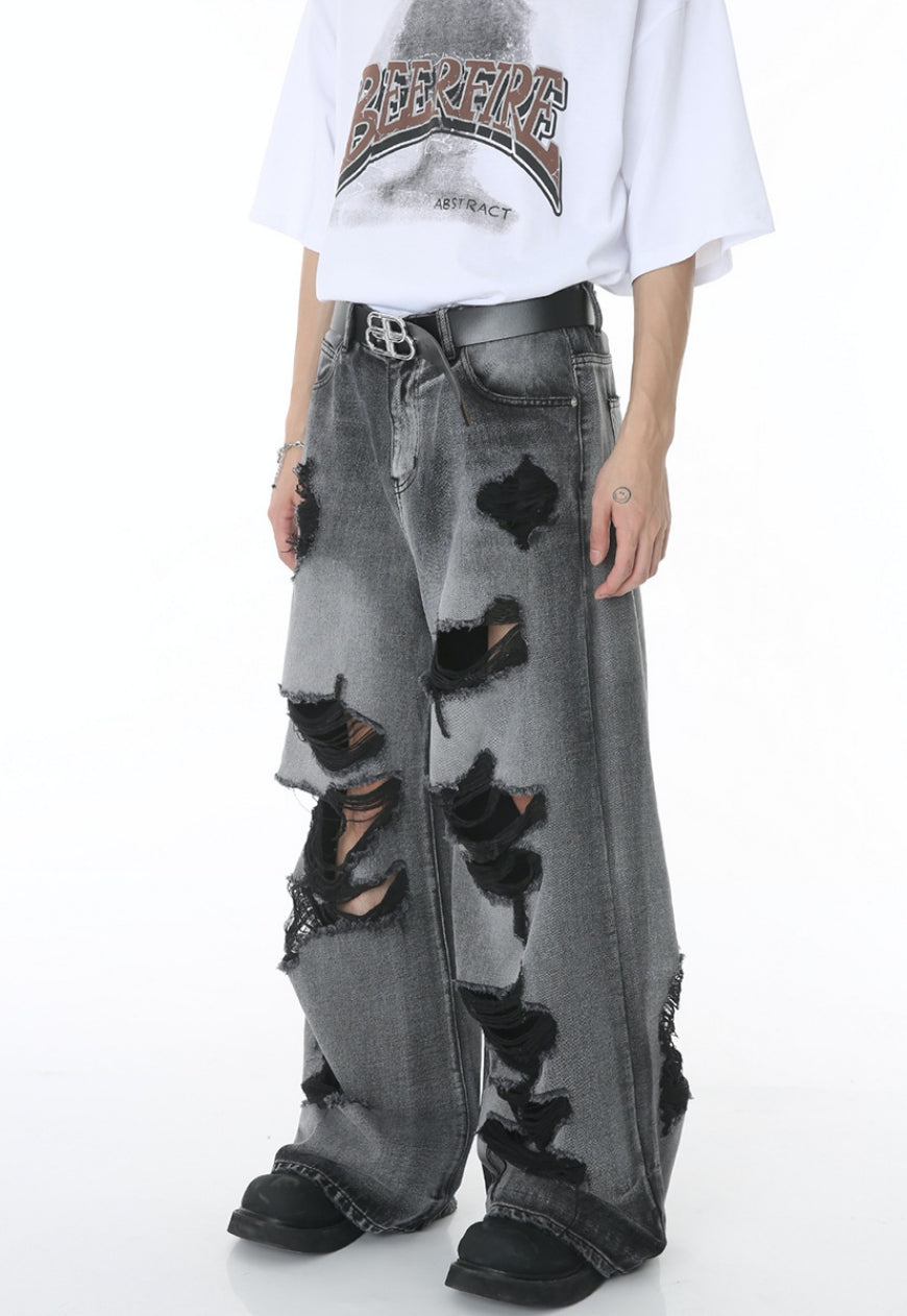 Unisex ripped floor mopping jeans