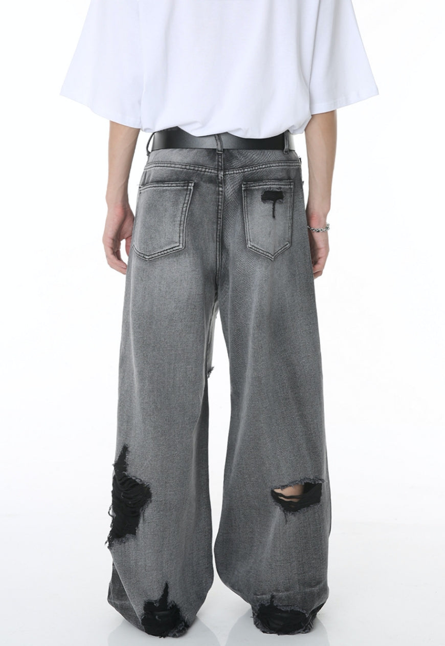 Unisex ripped floor mopping jeans